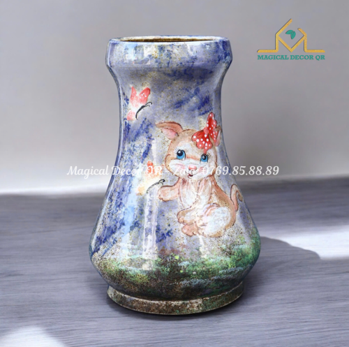 Cat's hand plays with butterfly